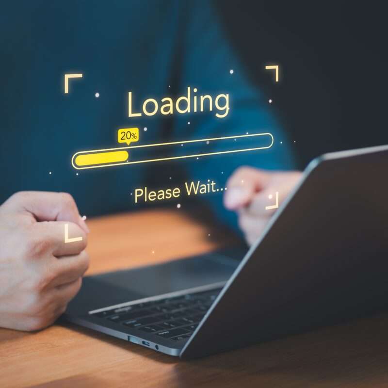 User,use,a,laptop,computer,to,download,and,update,software